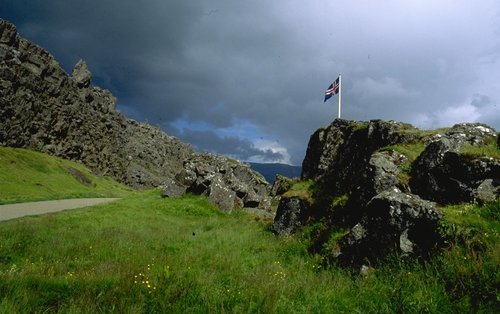 Flag at Þingvellir with heavy clouds